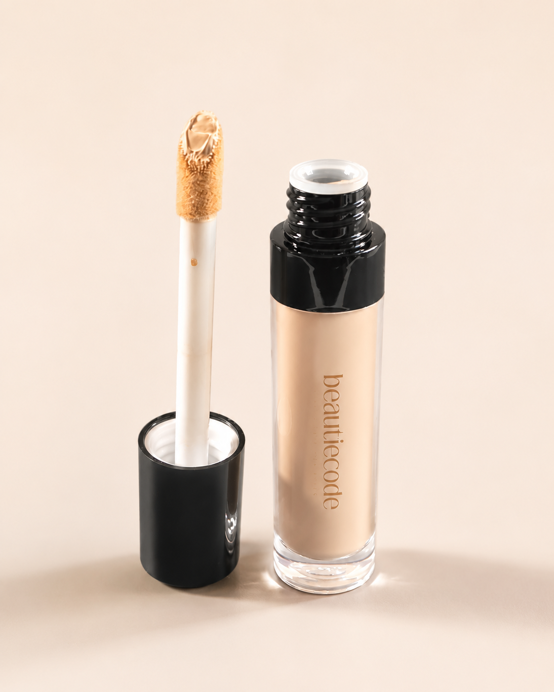 beautiecode full coverage concealer open showing the large doe foot and creamy product