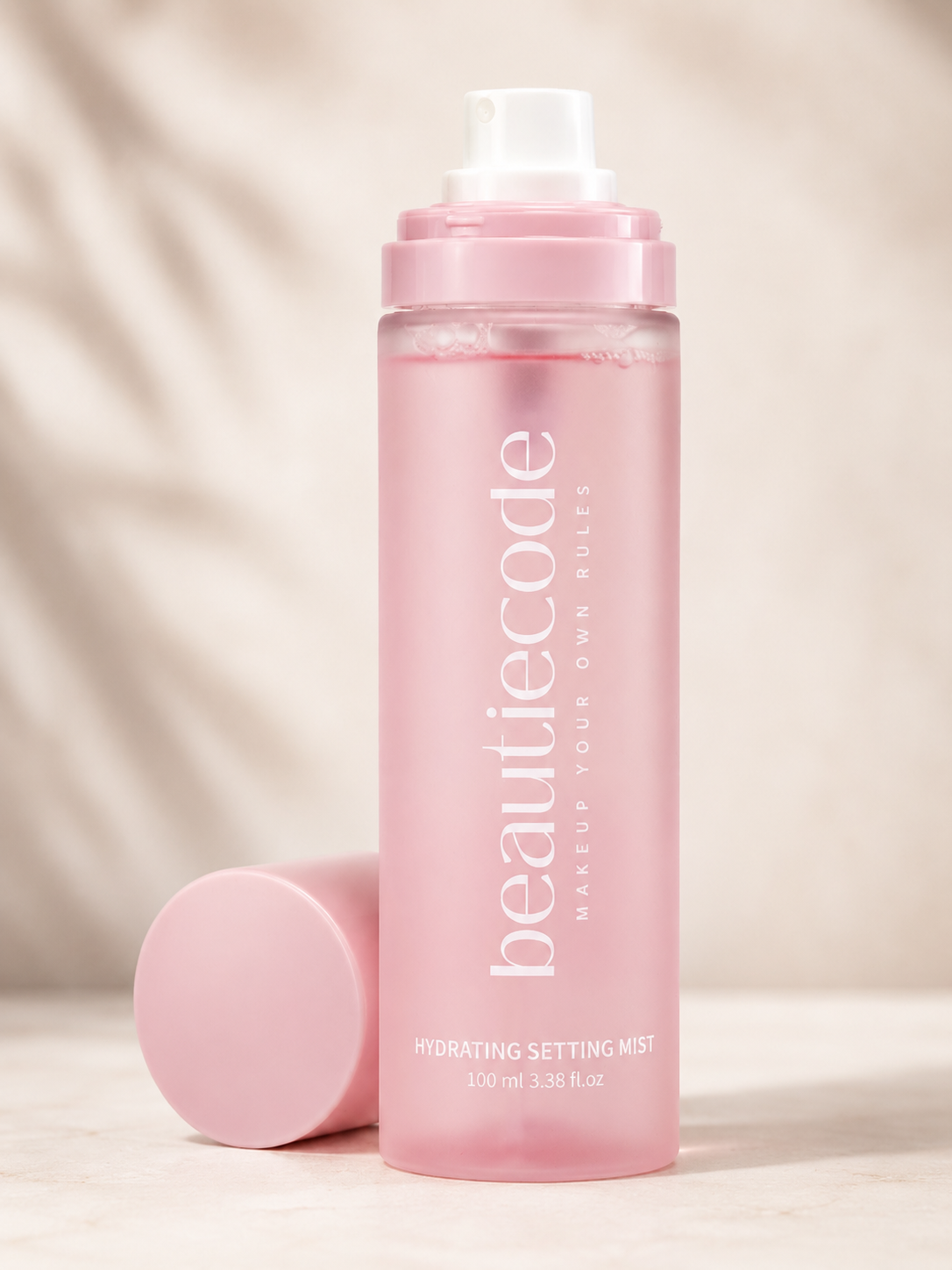beautiecode pinkbottle of hydrating mist with the lid sitting beside it